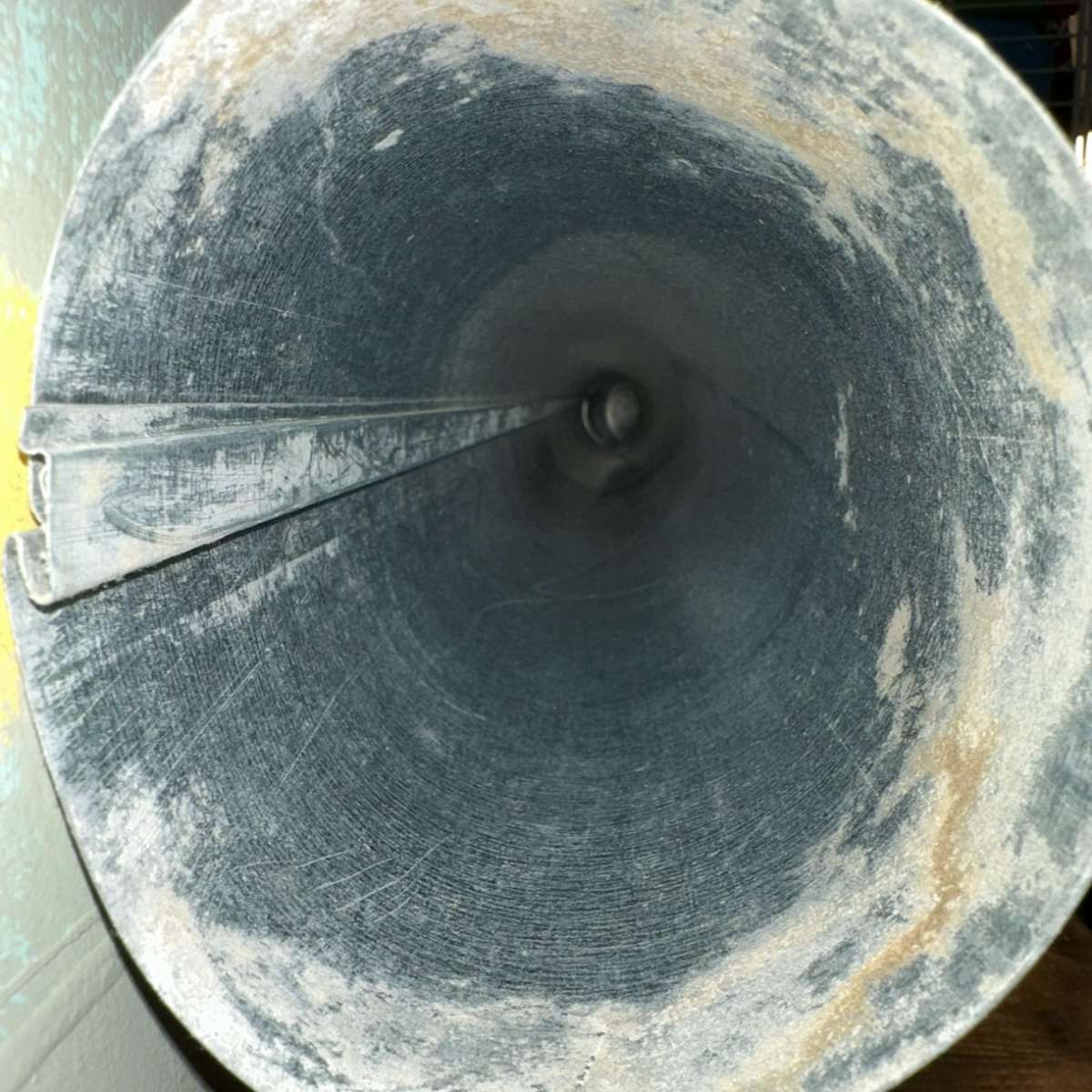 Close-up view of a dirty dryer vent duct showing lint buildup, emphasizing the need for professional cleaning services to improve air quality and reduce fire risks.