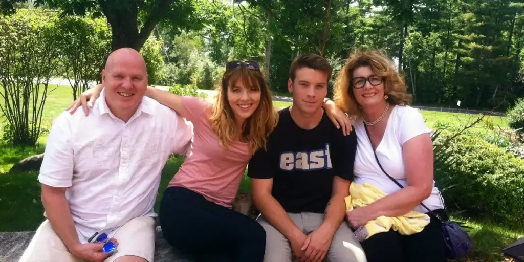 Family portrait of the Kealey family, smiling together outdoors, representing their commitment to community and family values in air duct and dryer vent cleaning services.