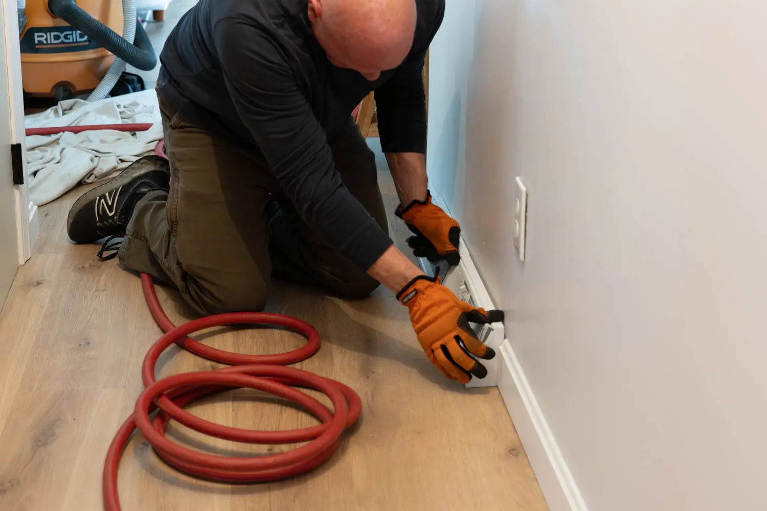 Kealey's technician performing thorough HVAC duct cleaning with professional equipment