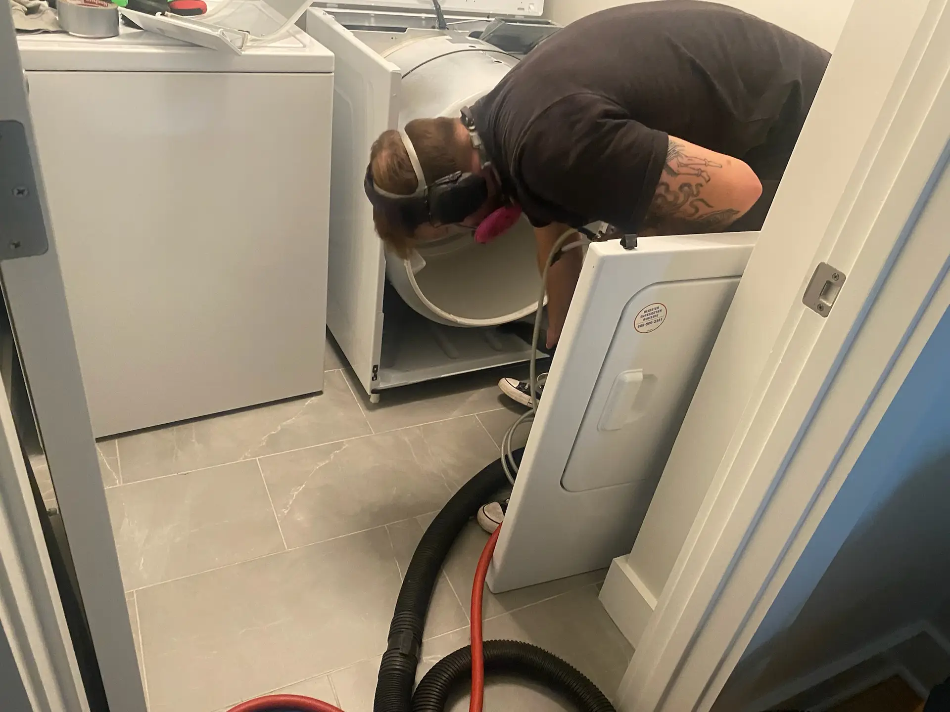 Kealey's technician cleaning dryer vent in Salisbury, MA home